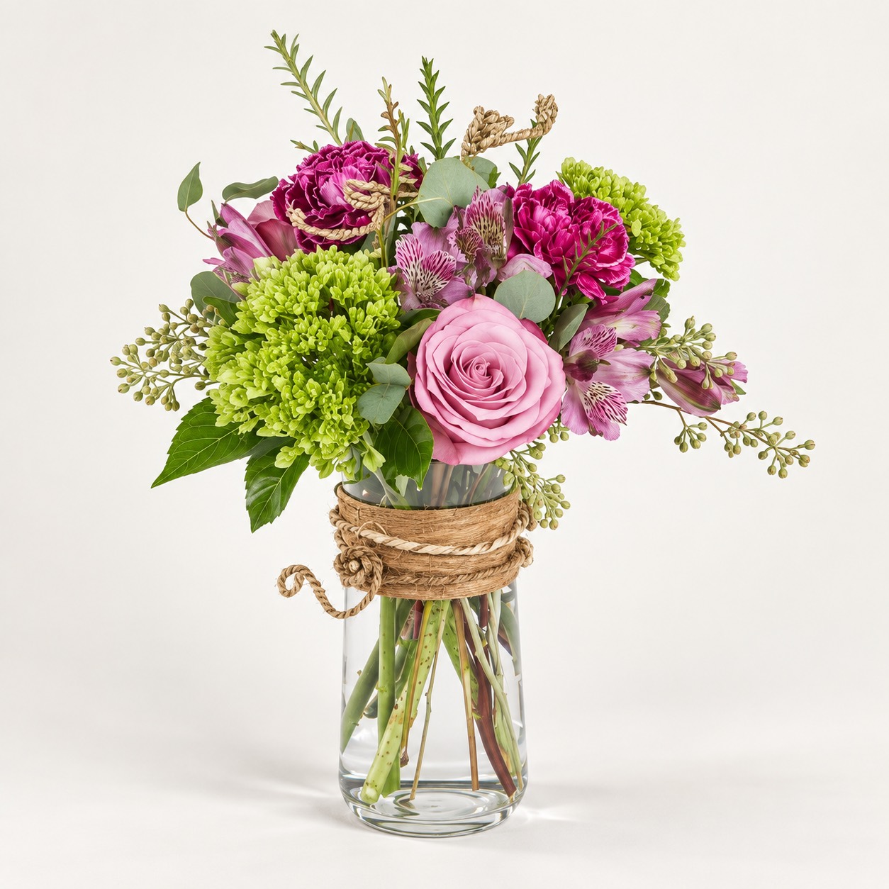 Yeşil ve pembe çiçeklerden sade vazo buketi